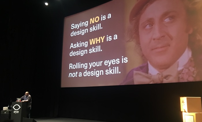 Mike in front of slide that says Saying NO is a design skill, asking why is a design skill, rolling your eytes is not a design skill